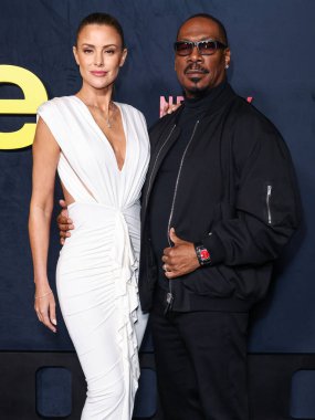 Avustralyalı aktris Paige Butcher ve kocası / Amerikalı aktör, şarkıcı ve komedyen Eddie Murphy, Netflix 'in 12 Kasım 2025' te Los Angeles, Los Angeles 'taki Netflix Tudum Tiyatrosu' nda düzenlenen 