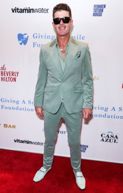 Amerikalı şarkıcı, söz yazarı ve müzik yapımcısı Robin Thicke, 11 Aralık 2025 'te Beverly Hilton Hotel' de düzenlenen Giving A Smile Foundation İIk Gala 2025 'e geldi..
