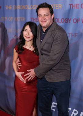 Marika Takeuchi Pruss and husband British film producer Michael A. Pruss arrive at the Los Angeles Premiere Of The Forge's 'The Chronology Of Water' held at 2220 Arts + Archives on January 8, 2026 in Historic Filipinotown, Los Angeles, California