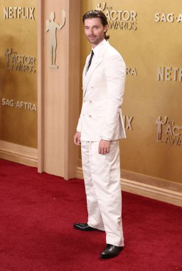 Patrick Schwarzenegger wearing Tom Ford arrives at the 32nd Annual Actor Awards Presented by SAG-AFTRA (formerly Screen Actors Guild Awards) held at the Shrine Auditorium and Expo Hall on March 1, 2026 in Los Angeles, California, United States.