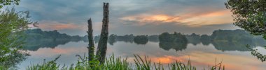 Tranquil evening lake reflection clipart