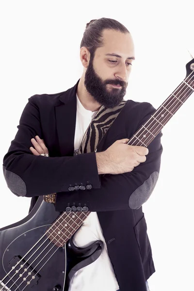 Studiový portrét mladých baskytarista na bílém pozadí — Stock fotografie