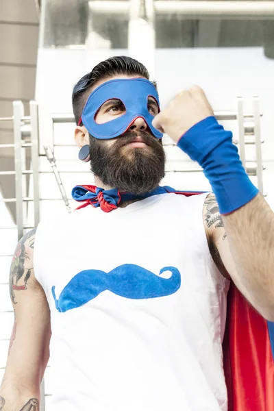 Young hipster superhero fights evil — Stock Photo, Image