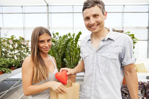 Couple in love - boyfriend gives the symbol of his heart — Stock Photo, Image