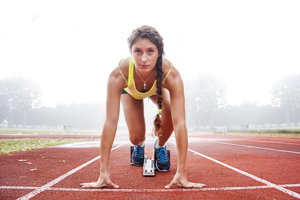 Athlete on the starting blocks — Stock Photo, Image