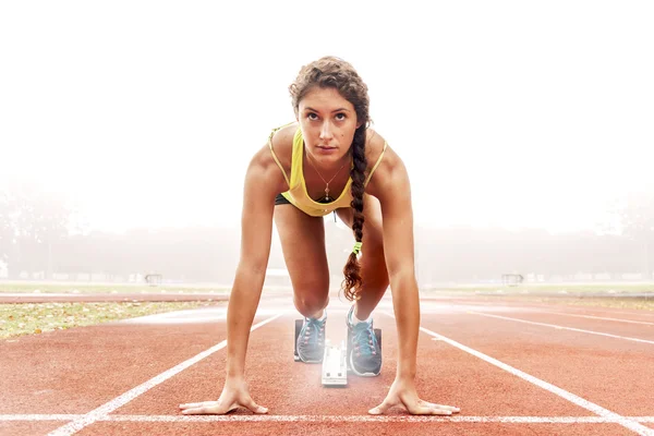 Athlete on the starting blocks — Stock Photo, Image