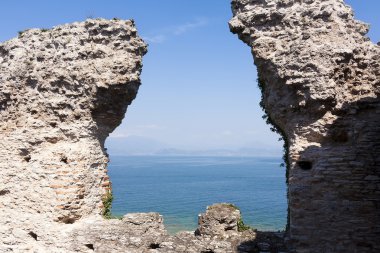 roman ruins of catullo caves on lake garda italy clipart