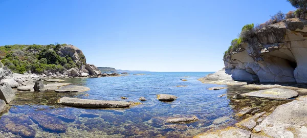Panorama of blue sea and the rocky reef in the west coast Sardin — Stock Photo, Image