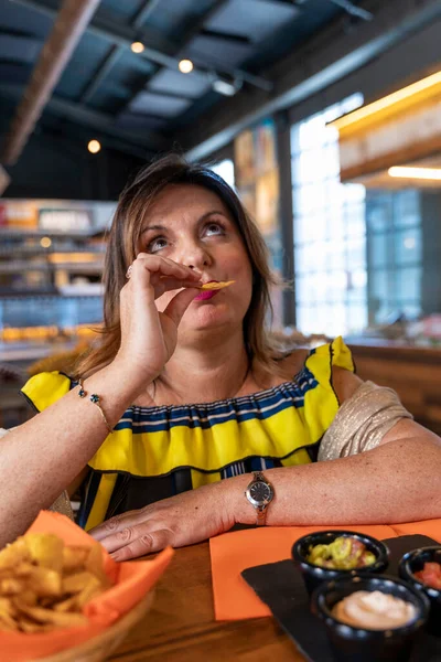 Funny Portrait Elegant Mature Woman Eating Fried Potato Pub — Stock Photo, Image