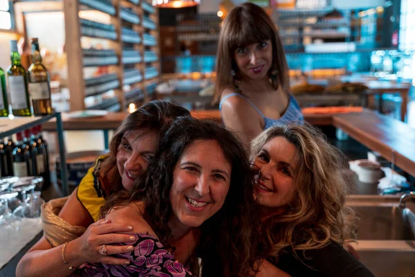 Group Mature Women Smiling Hugging Each Other Pub — Stock Photo, Image