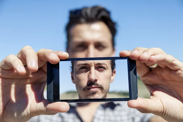 Young cute adult take a selfie with smart phone — Stock Photo, Image