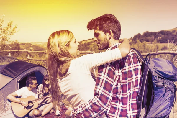 Young couple kissing in a camping of the hill — Stock Photo, Image