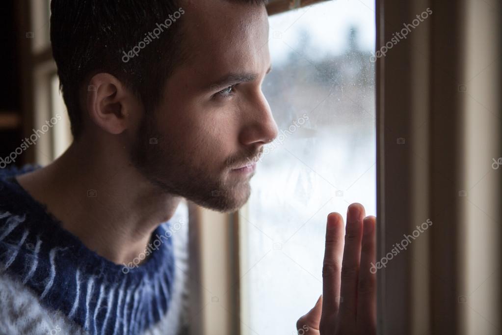 a man looking through a window