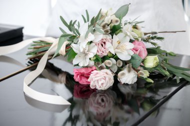 the bride's bouquet lies on the piano clipart