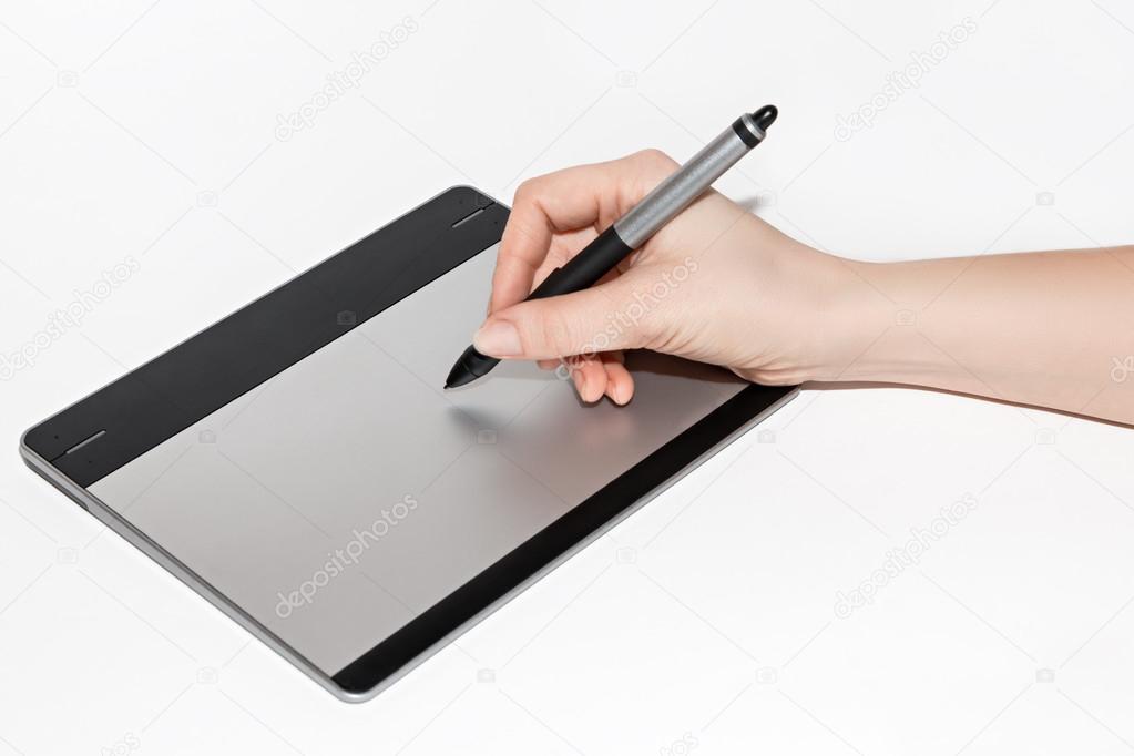 Graphic tablet, hand and feather 