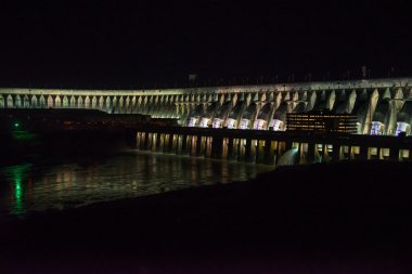 Illuminated Itaipu Dam at night in Foz  clipart