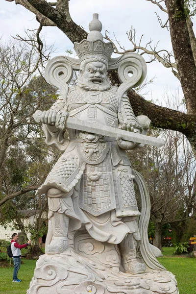 Statue of a Chinese warrior at the Buddhist temple — Stock Photo, Image