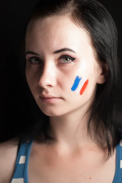 Cara de mujer pintada con bandera de Francia — Foto de Stock