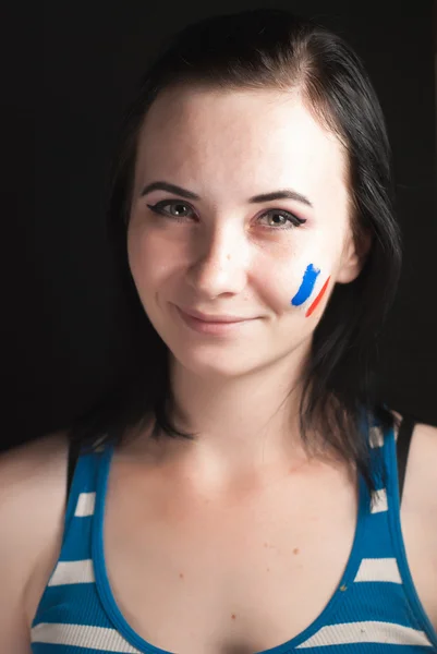 Cara de mujer pintada con bandera de Francia — Foto de Stock