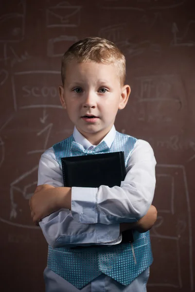 Little schoolboy with blond hair in a nice suit, — Stock Photo, Image