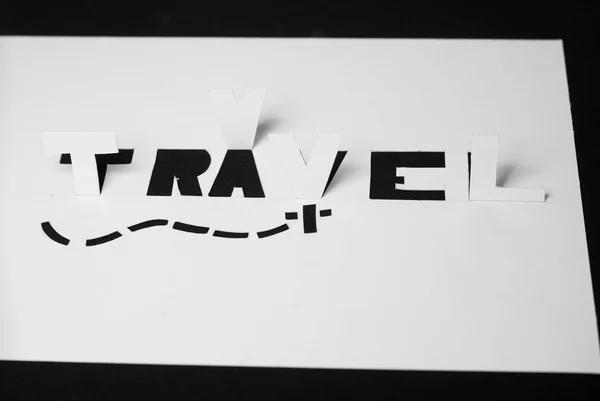 The word travel cut from paper, — Stock Photo, Image