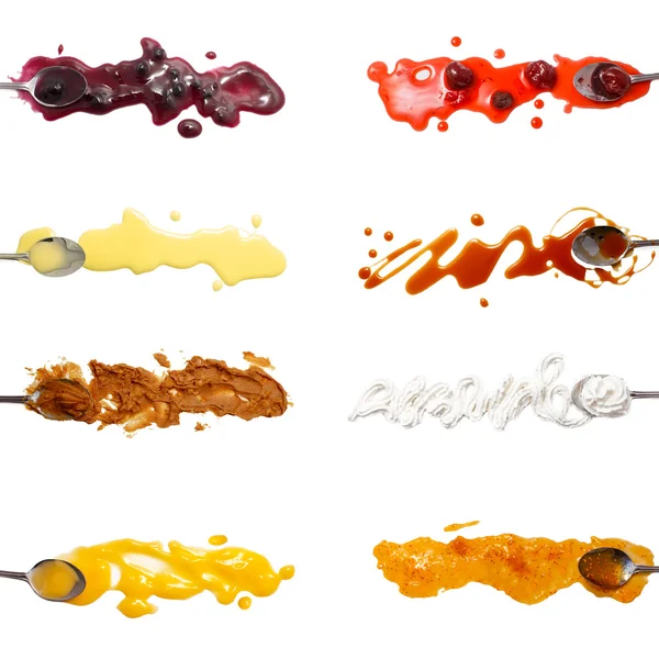 Set of 8 sweet sauces and toppings isolated on white — Stock Photo, Image