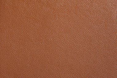 Red-brown fine texture of genuine leather. Natural expensive products.