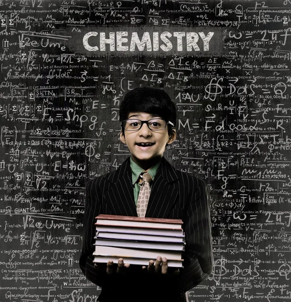 Química. Genius Little Boy Holding Libro con gafas Chalkb —  Fotos de Stock