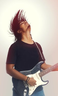 Young Men Wearing Casual Clothing Playing Electric Guitar clipart