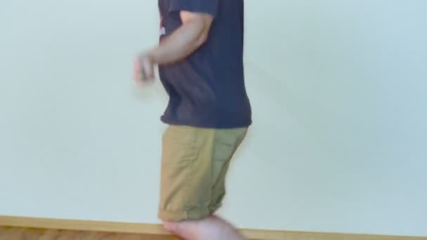 Man Jumping on Skipping Rope in T-Shirt Indoor — Stock Video