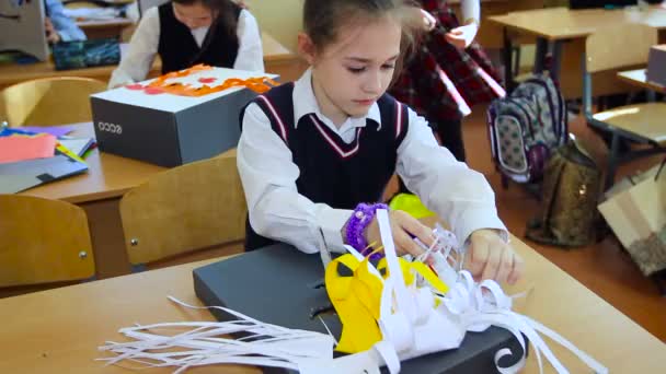 Little Girl Glues Homemade Mask at the School. Caucasian — Stock Video