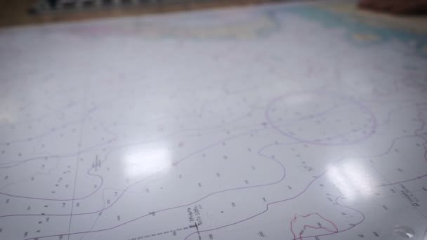 Submarine control panel. Sea chart is on the table. Man presses a button — Stock Video