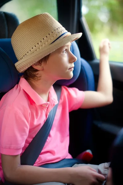 Little boy sits in the safety seat — Stock Photo, Image