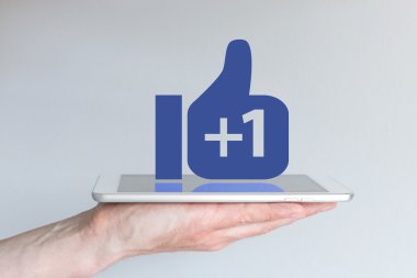 Social network and like concept with tablet on hand