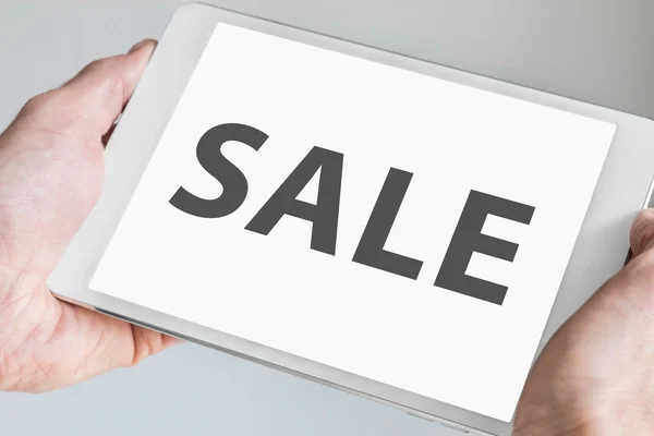 Sale text displayed on modern tablet as concept for online shopping and sales — 스톡 사진