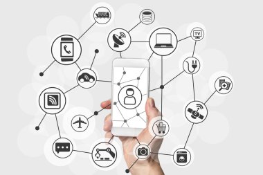 Internet of things (IOT) concept with hand holding modern smart phone