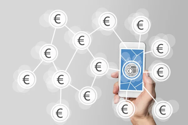 Mobile e-payment and e-commerce concept with hand holding modern smartphone in front of neutral grey background — Zdjęcie stockowe