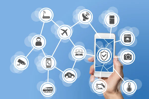 Internet of things security concept illustrated by hand holding modern smart phone with connected sensors in objects. — Stock Photo, Image