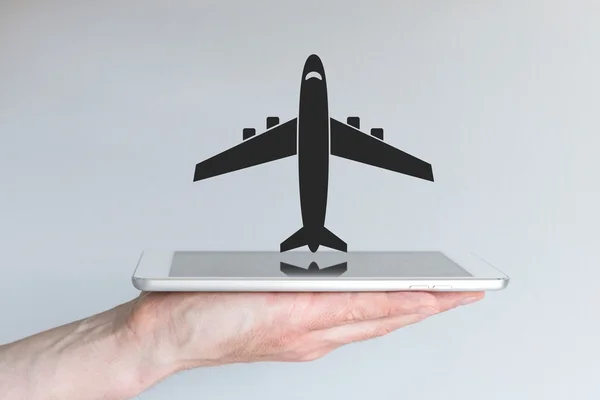 Online flight booking concept with smart phone or tablet. — Stok fotoğraf