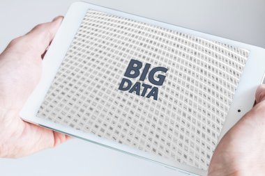 Two hands holding tablet. Big data concept.