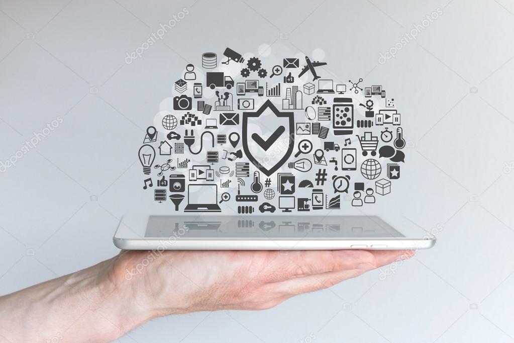 Cloud computing security concept with male hand holding tablet