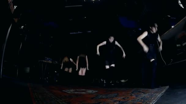 Contemporary dance performance of four dancers on dark — Stock Video