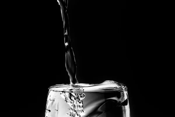 Pouring liquid into wineglass — Stock Photo, Image