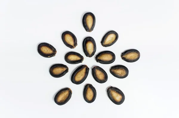 Семена арбуза на белом фоне — стоковое фото