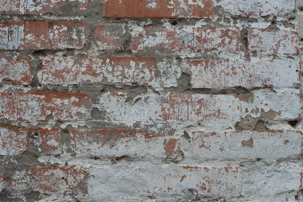 Antigua pared de ladrillo sucio con pelado yeso, textura — Foto de Stock