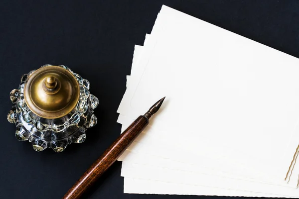 Background with fountain pen, inkwell, papers