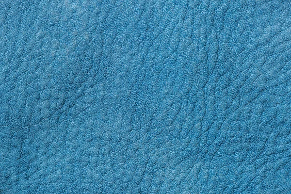 Genuine leather texture, blue denim color, matte surface, with wrinkles and cracks, trendy background. Fashion handbags. Concept of shopping, manufacturing — Stock Photo, Image