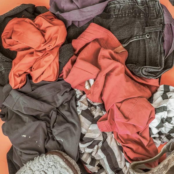 Pile of used clothes. Disposal, second hand, recycling concept — Stock Photo, Image