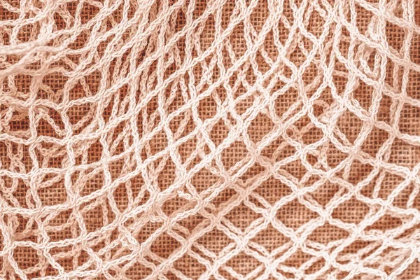 Mesh string bag close-up, reusable bag option, texture, natural background. Recycling, ecology, zero waste concept — Stock Photo, Image