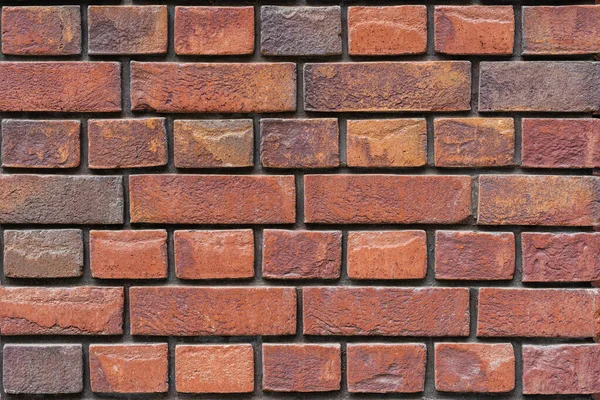 Texture of red brown brick wall, surface close-up. Colorful grunge Background, copy space — Stockfoto